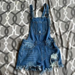 Cute blue distressed overalls! Size XS but can fit a small.